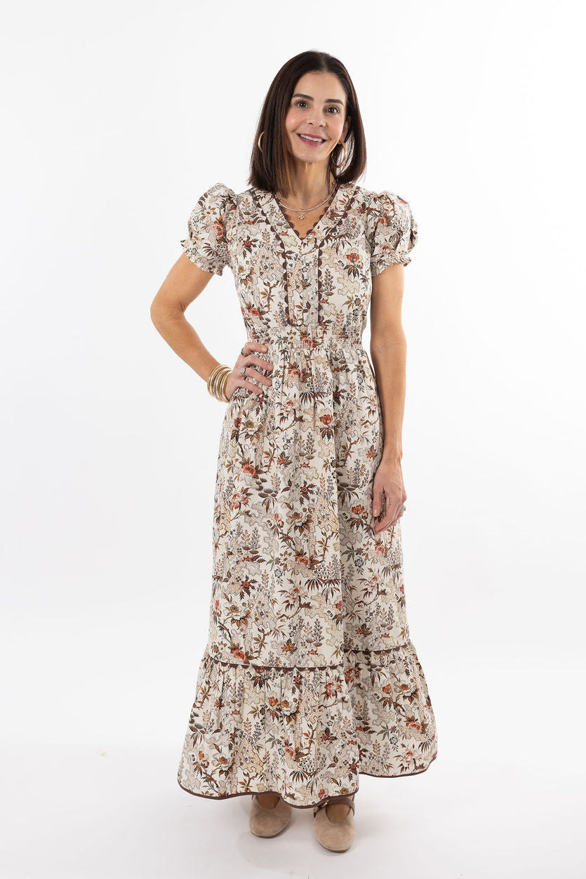 Woman wearing a floral dress on a white background