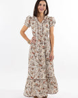 Woman wearing a floral dress on a white background