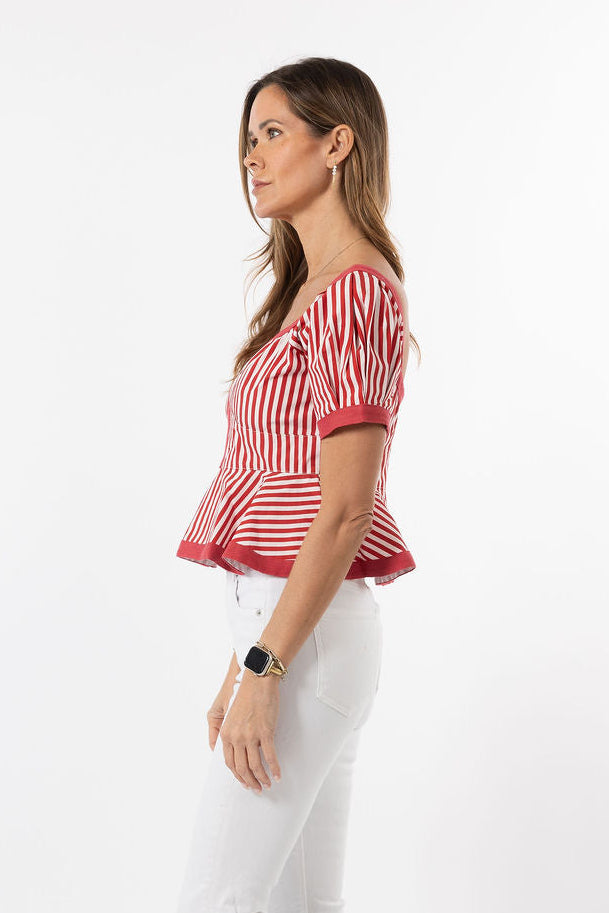 Woman wearing a red and white striped shirt on a white background