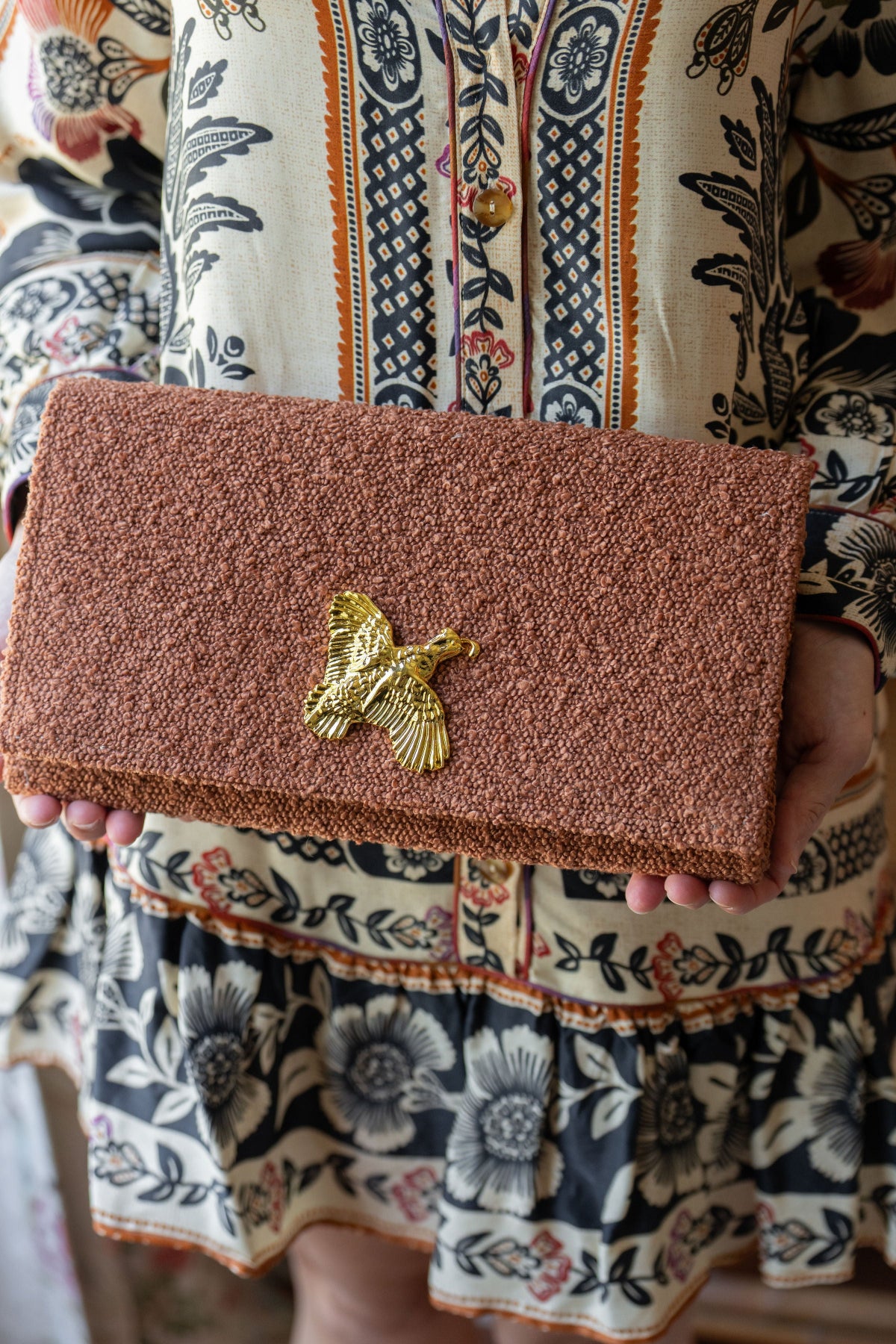 brown clutch with pheasant 